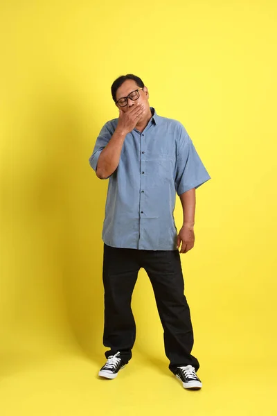Adult Asian Man Blue Shirt Standing Yellow Background — Zdjęcie stockowe