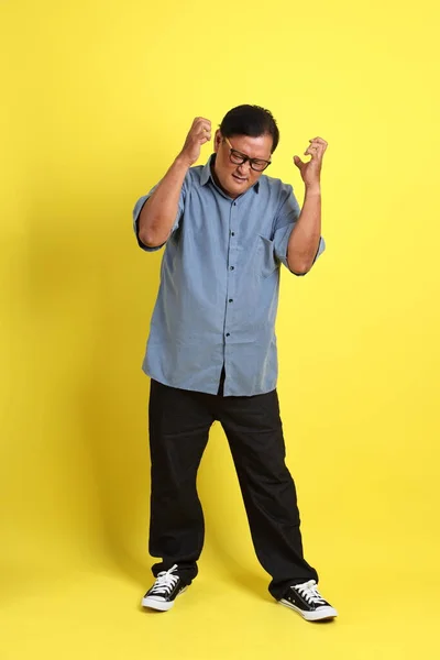 Adult Asian Man Blue Shirt Standing Yellow Background — 스톡 사진