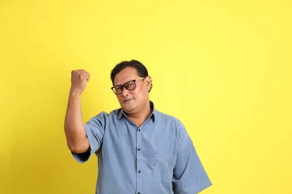 Adult Asian Man Blue Shirt Standing Yellow Background — Stok fotoğraf