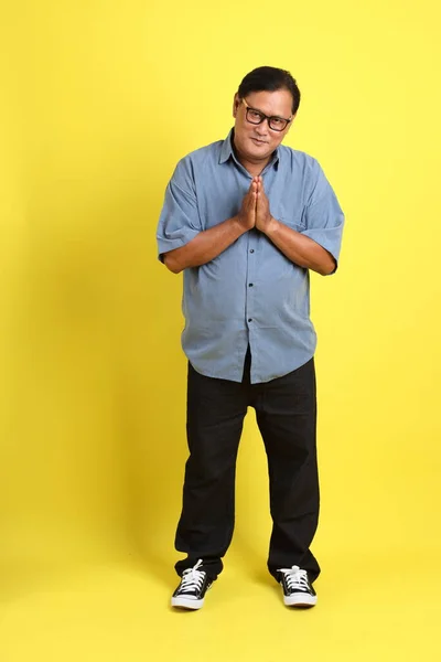 Adult Asian Man Blue Shirt Standing Yellow Background — Fotografia de Stock