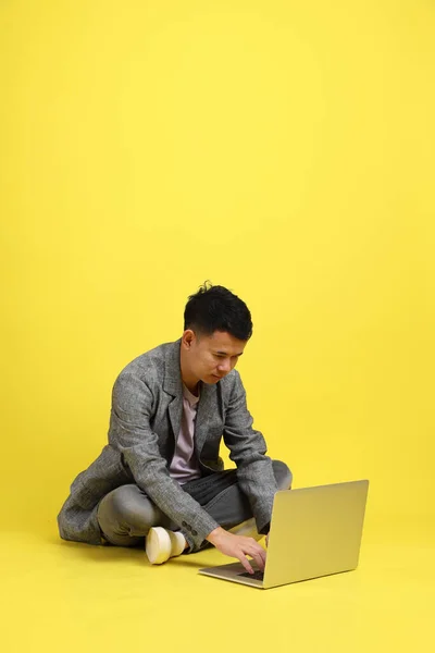 Asian Lgbtq Man Grey Blazer Sitting Yellow Background — 图库照片