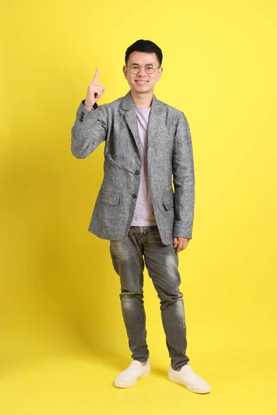 Asian Lgbtq Man Grey Blazer Standing Yellow Background — Stock Fotó