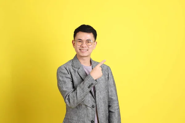 Asian Lgbtq Man Grey Blazer Standing Yellow Background — Stok fotoğraf