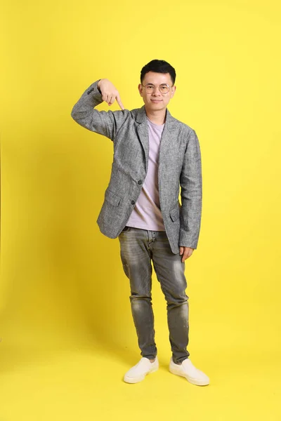 Asian Lgbtq Man Grey Blazer Standing Yellow Background — 图库照片
