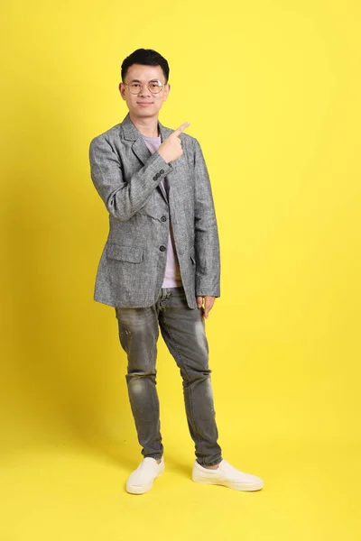 Asian Lgbtq Man Grey Blazer Standing Yellow Background — Stockfoto