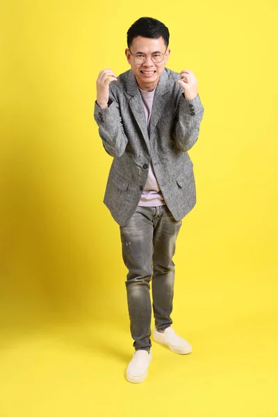 Asian Lgbtq Man Grey Blazer Standing Yellow Background — Stockfoto