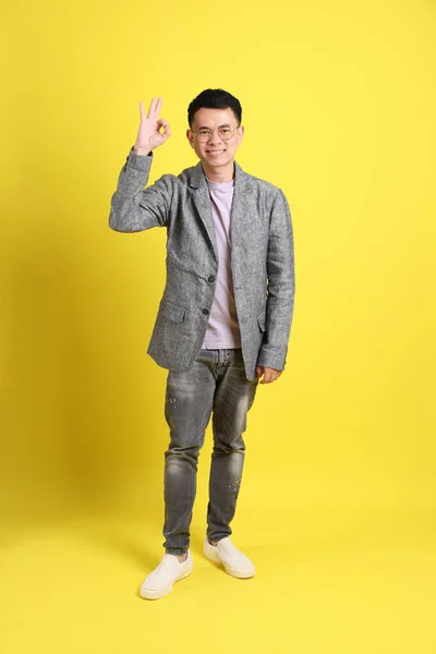 Asian Lgbtq Man Grey Blazer Standing Yellow Background — Stockfoto