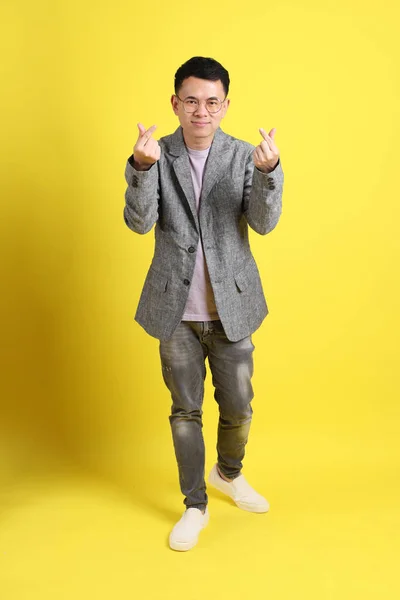Asian Lgbtq Man Grey Blazer Standing Yellow Background — Zdjęcie stockowe