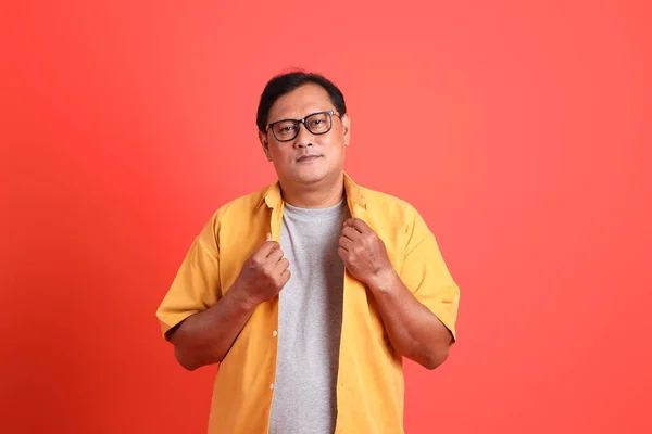 Adult Asian Man Yellow Shirt Standing Orange Background — Foto Stock