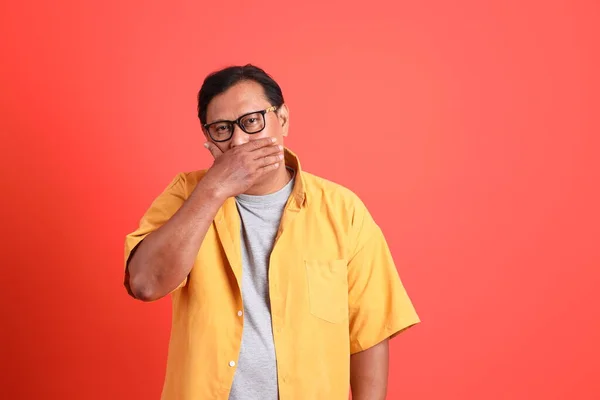 Adult Asian Man Yellow Shirt Standing Orange Background — Stok fotoğraf