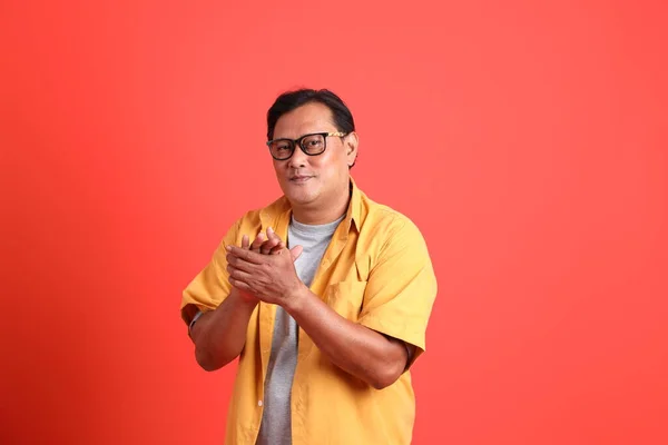 Adult Asian Man Yellow Shirt Standing Orange Background — Stockfoto