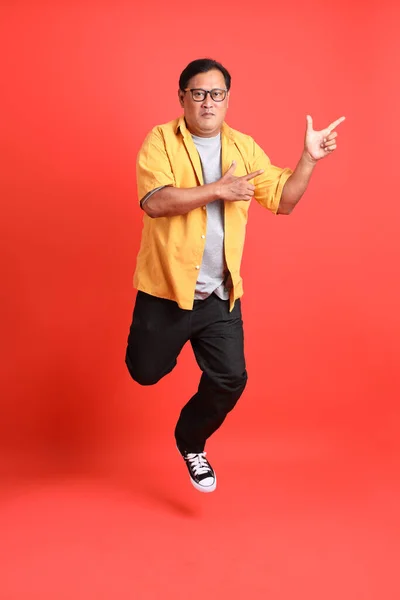 Adult Asian Man Yellow Shirt Standing Orange Background — Fotografia de Stock