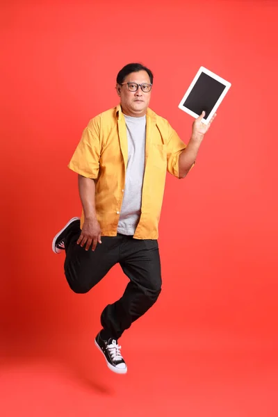 Adult Asian Man Yellow Shirt Standing Orange Background — Fotografia de Stock