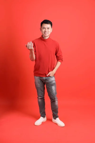 Asian Lgbtq Man Red Shirt Standing Orange Background — Zdjęcie stockowe