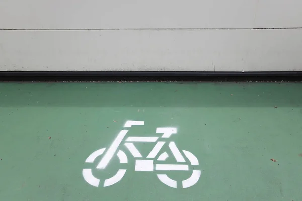The icon of bicycle sign on the floor for parking bicycle area.