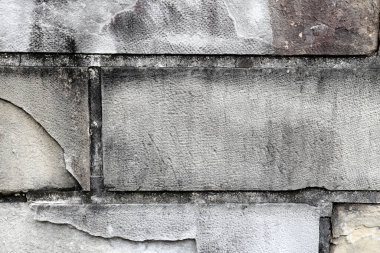 The old stone brick background showing the ruined from aged.