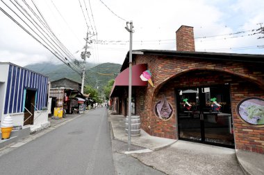 Oita, Japan - July 21, 2022: The street view of small town in Oita, Japan named Yufuin.