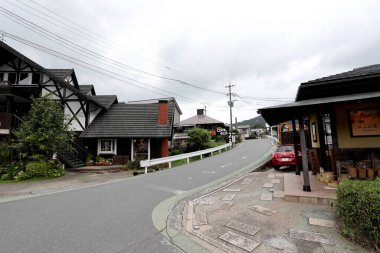 Oita, Japan - July 21, 2022: The street view of small town in Oita, Japan named Yufuin.