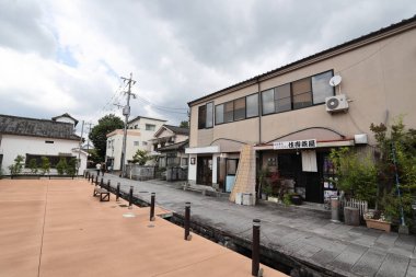 Beppu, Japan - July 22, 2022: Mamedamachi Shopping Street is a walking path filled with ancient shops selling products from art and craft.