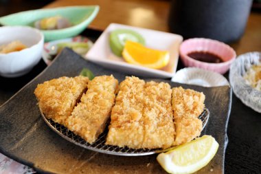 The crispy deep fried pork named donkatsu served with Japanese rice and Miso soup.