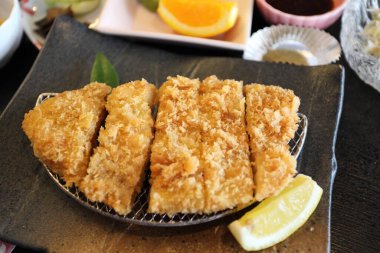 The crispy deep fried pork named donkatsu served with Japanese rice and Miso soup.