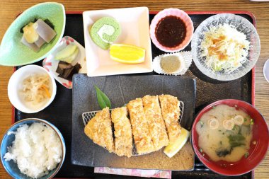 The crispy deep fried pork named donkatsu served with Japanese rice and Miso soup.