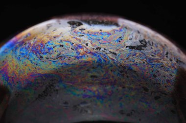 The abstact element on the soap bubble with the dark background.