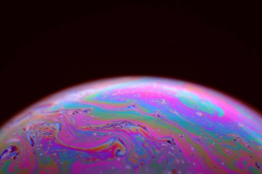 The abstact element on the soap bubble with the dark background.