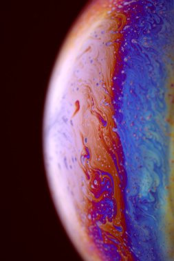 The abstact element on the soap bubble with the dark background.