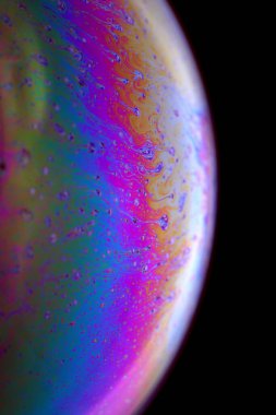 The abstact element on the soap bubble with the dark background.