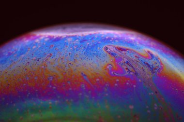 The abstact element on the soap bubble with the dark background.