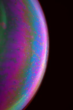 The abstact element on the soap bubble with the dark background.