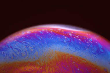 The abstact element on the soap bubble with the dark background.