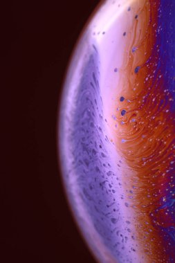 The abstact element on the soap bubble with the dark background.