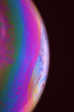 The abstact element on the soap bubble with the dark background.