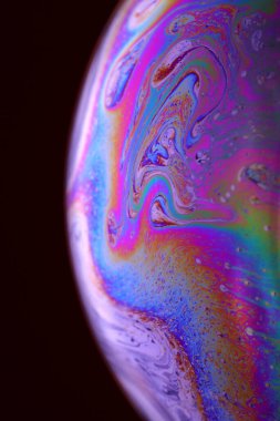The abstact element on the soap bubble with the dark background.