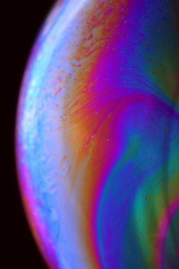 The abstact element on the soap bubble with the dark background.