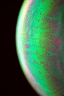 The abstact element on the soap bubble with the dark background.