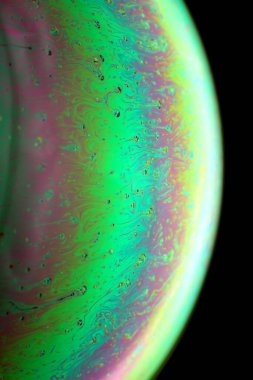 The abstact element on the soap bubble with the dark background.
