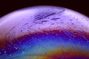 The abstact element on the soap bubble with the dark background.