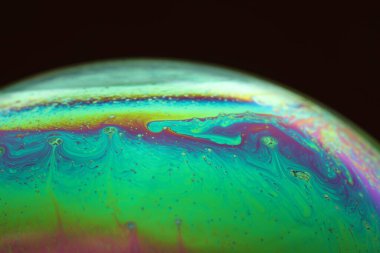 The abstact element on the soap bubble with the dark background.