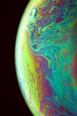 The abstact element on the soap bubble with the dark background.