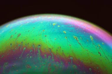 The abstact element on the soap bubble with the dark background.