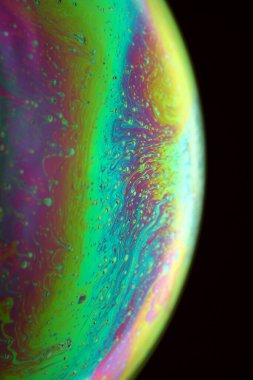 The abstact element on the soap bubble with the dark background.