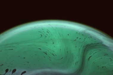 The abstact element on the soap bubble with the dark background.