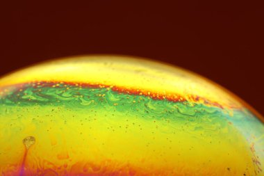 The abstact element on the soap bubble with the dark background.