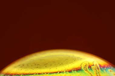 The abstact element on the soap bubble with the dark background.