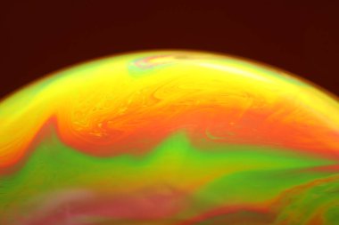 The abstact element on the soap bubble with the dark background.