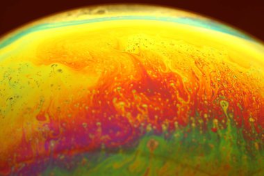 The abstact element on the soap bubble with the dark background.