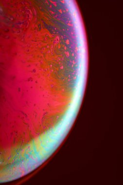 The abstact element on the soap bubble with the dark background.